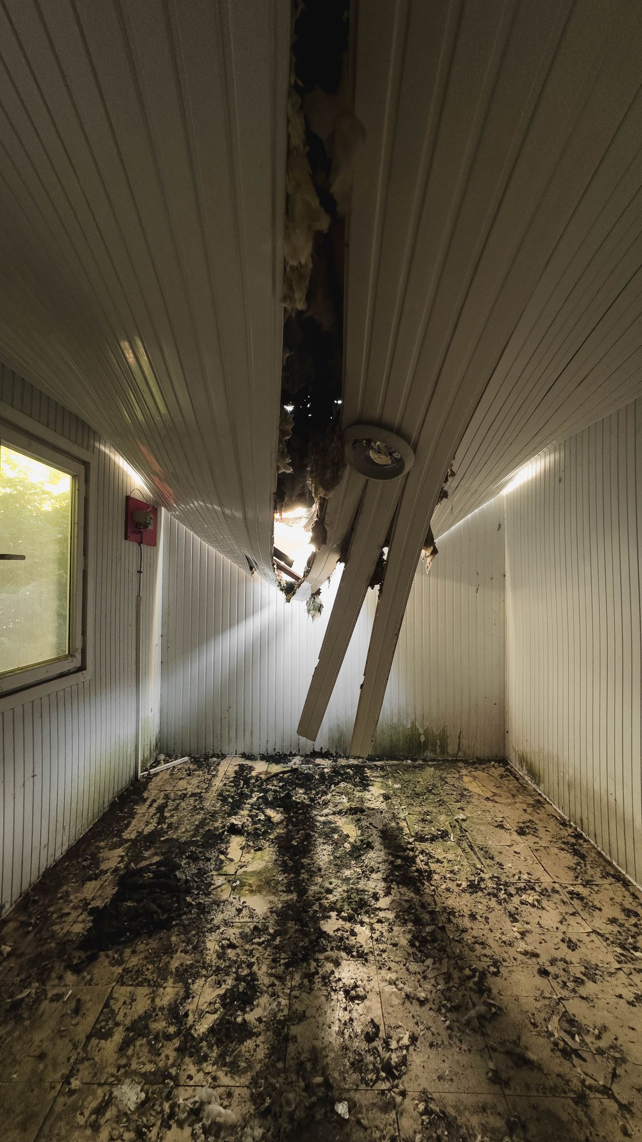 Ceiling collapsed and damaged from a water leak before repair